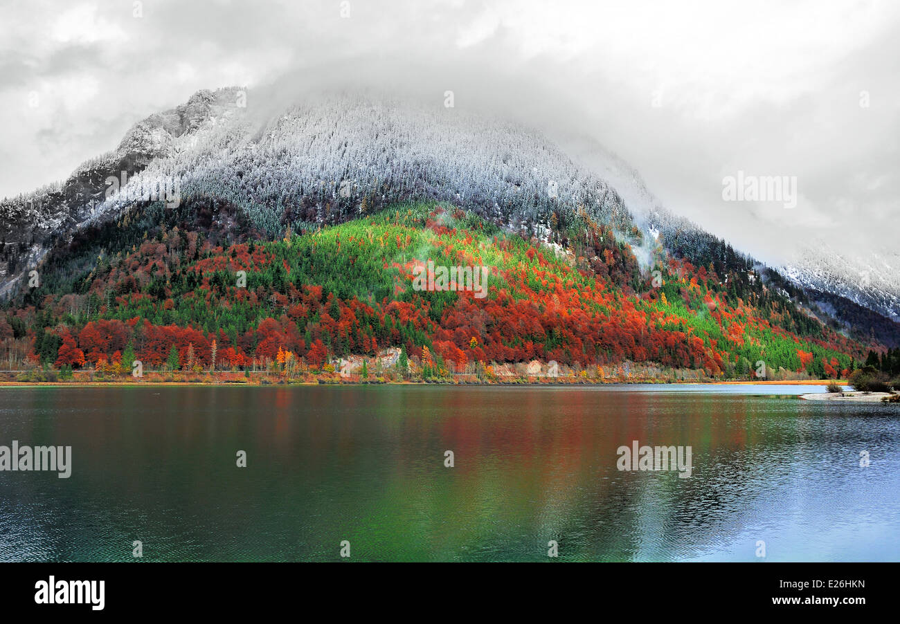 Idyllic onset of winter in the alps at a mountain lake Stock Photo