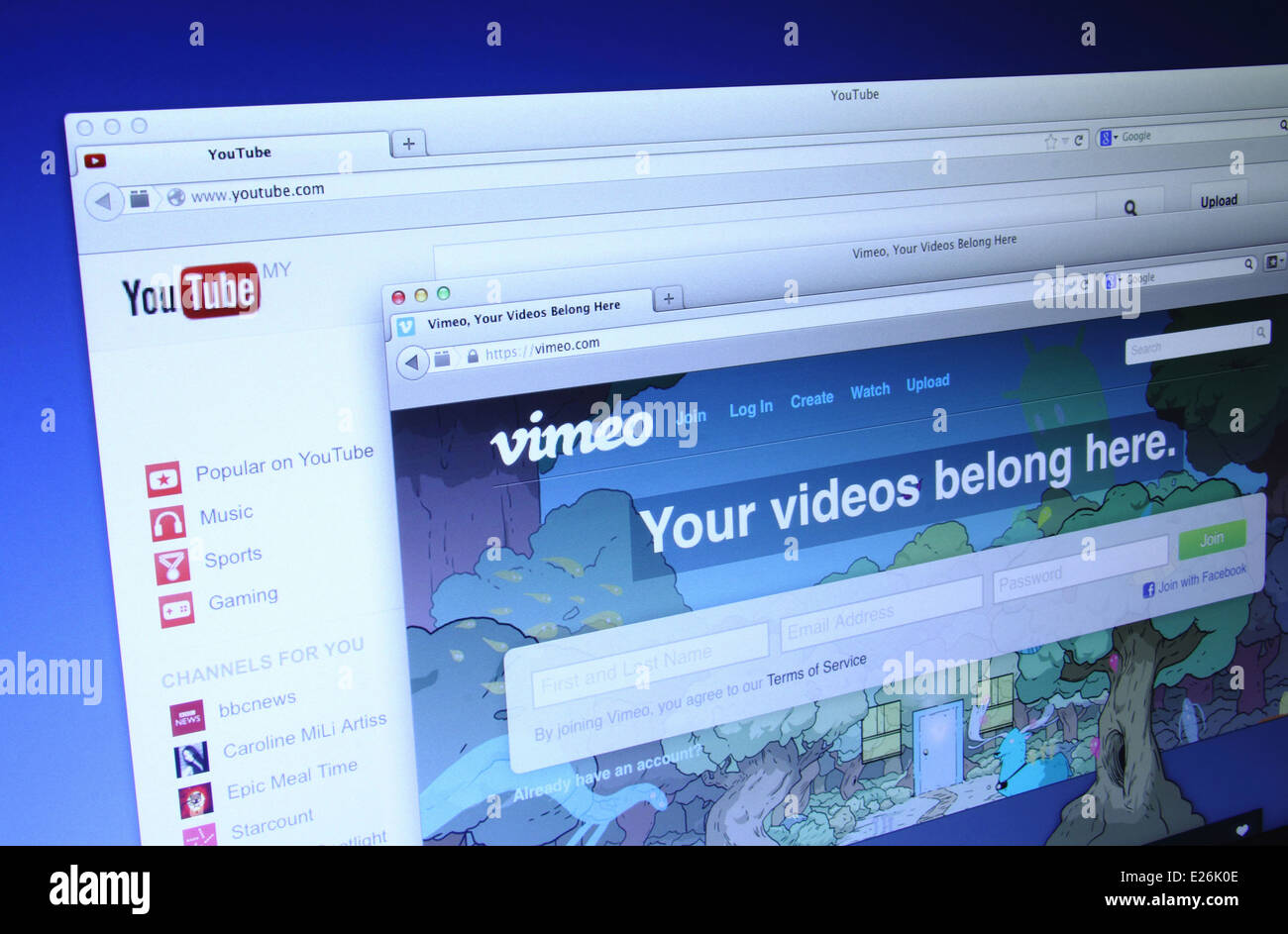 Photo of Youtube and Vimeo homepage on a monitor screen, They provides a platform for create, connect and discover the world's v Stock Photo