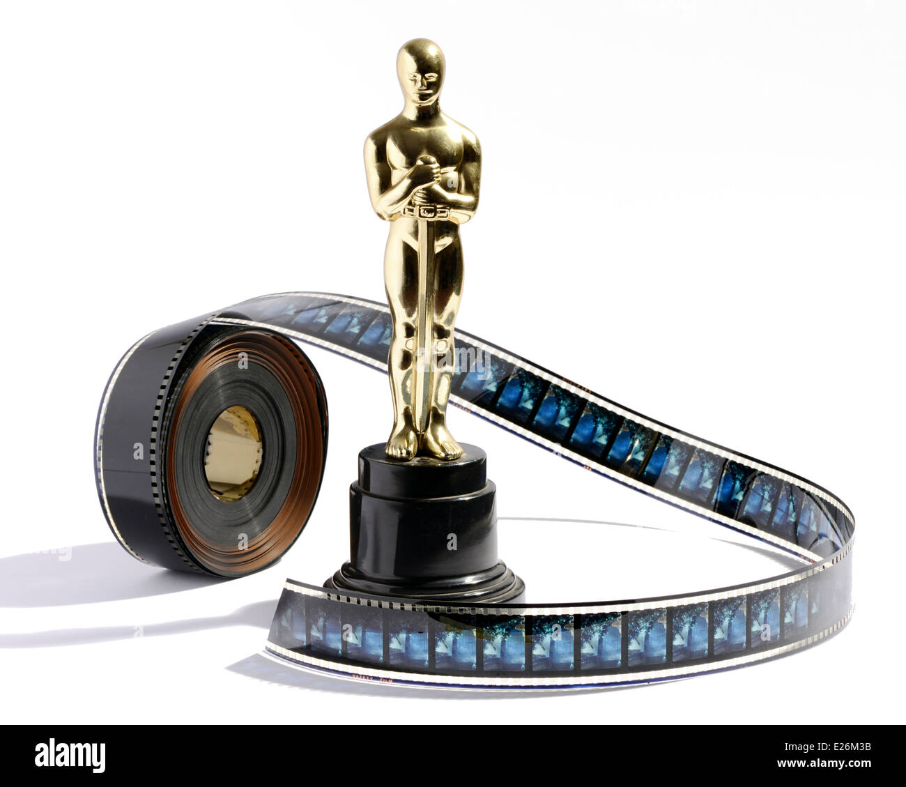 Replica Oscar statue with a roll of movie film Stock Photo