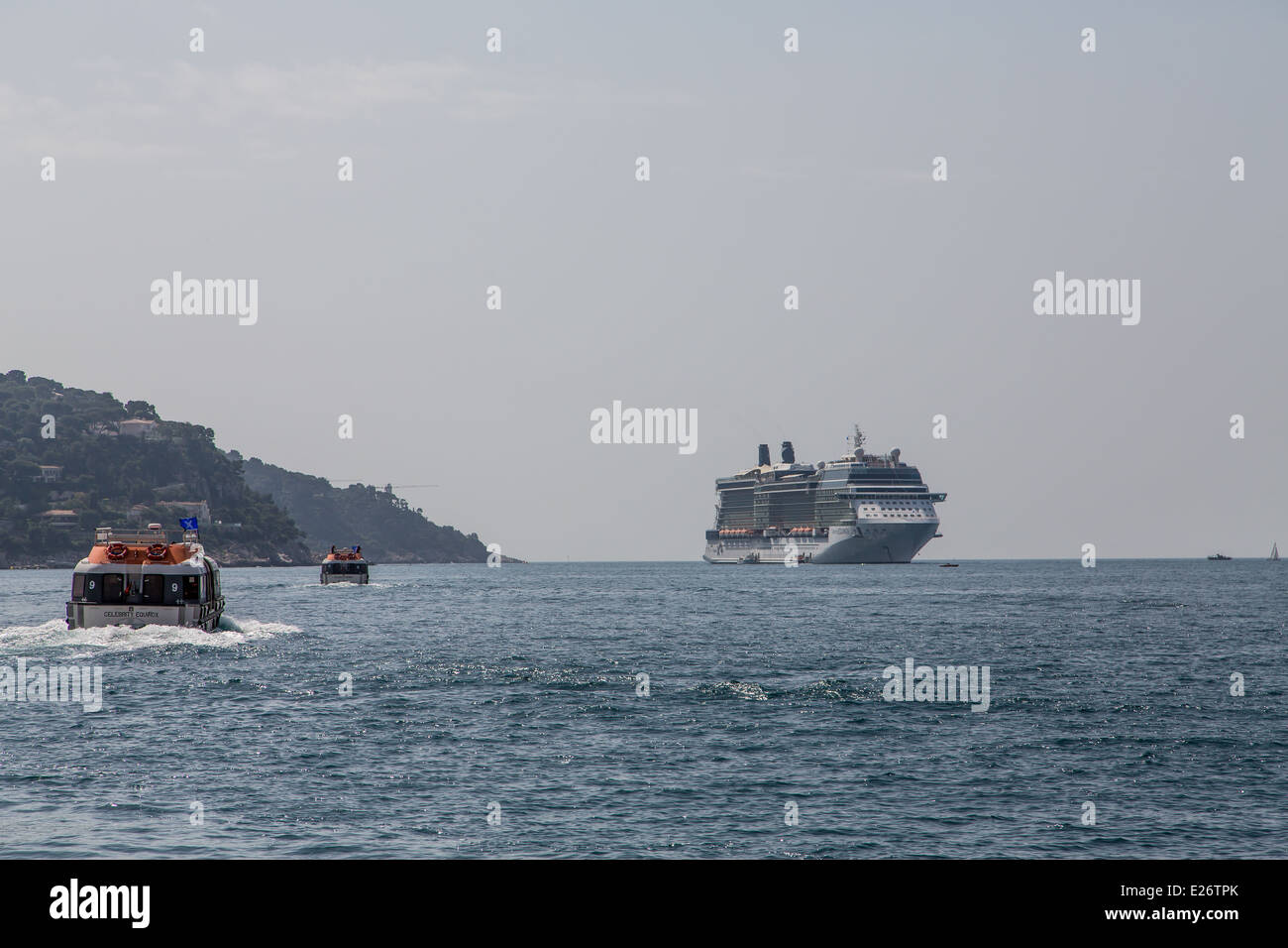 Lifeboats shuttling passengers to a cruise ship Stock Photo