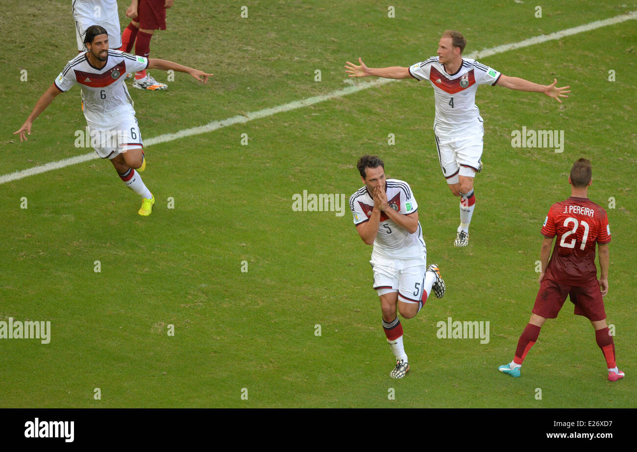 Salvador da Bahia, Brazil. 16th June, 2014. Salvador da Bahia, Brazil.  16th June, 2014. Mats Hummels (3rd R) of Germany celebrates after scoring the second goal with Sami Khedira (L) and Benedikt Höwedes (2nd R) in front of Joao Pereira of Portugal during the FIFA World Cup 2014 group G preliminary round match between Germany and Portugal at the Arena Fonte Nova Stadium in Salvador da Bahia, Brazil, 16 June 2014. Photo: Thomas Eisenhuth/dpa/Alamy Live News EDITORIAL USE ONLY Credit:  dpa picture alliance/Alamy Live News Stock Photo