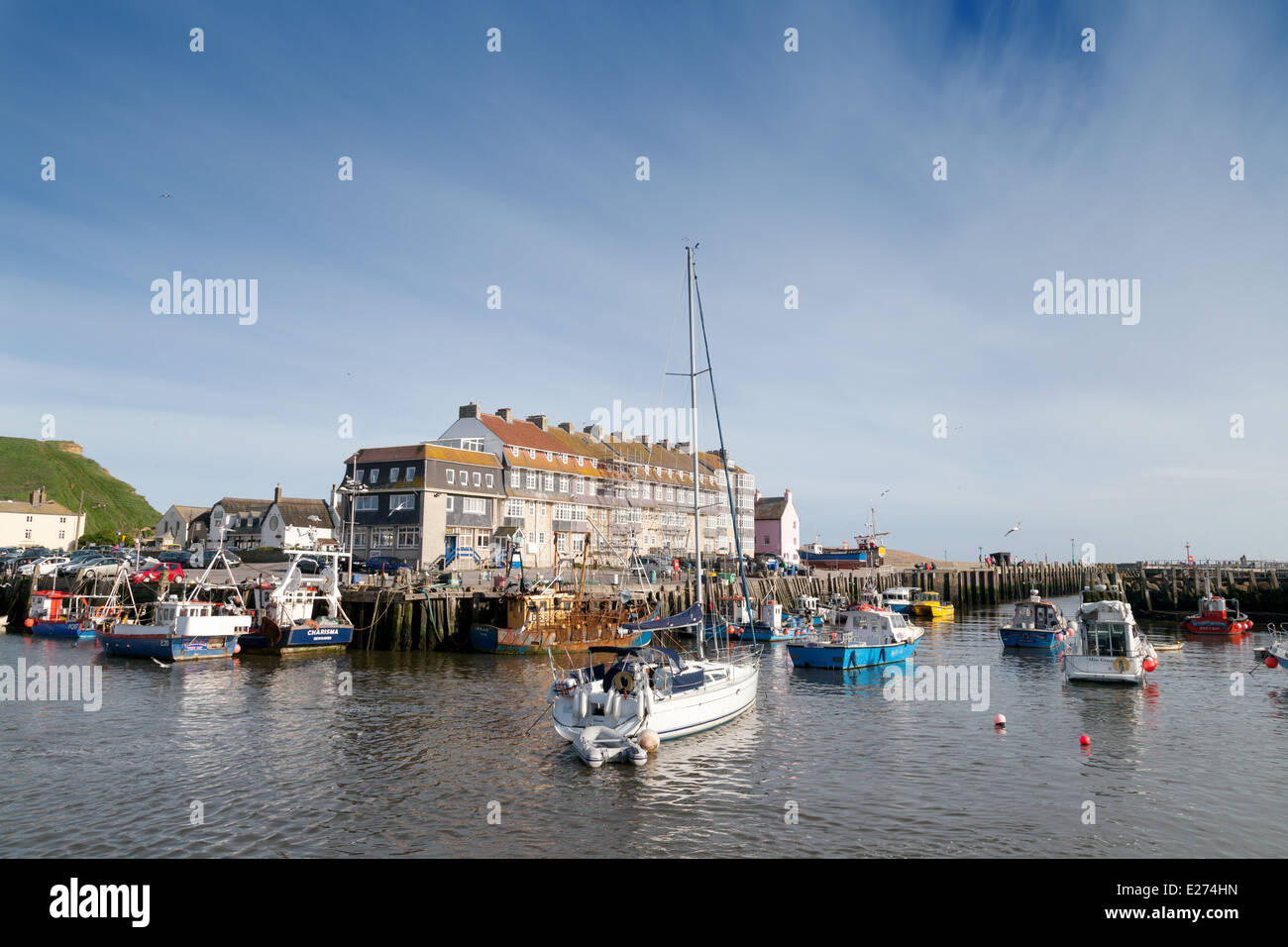 Boats in West Bay, Bridport Harbour in summer, Dorset South West England UK Stock Photo