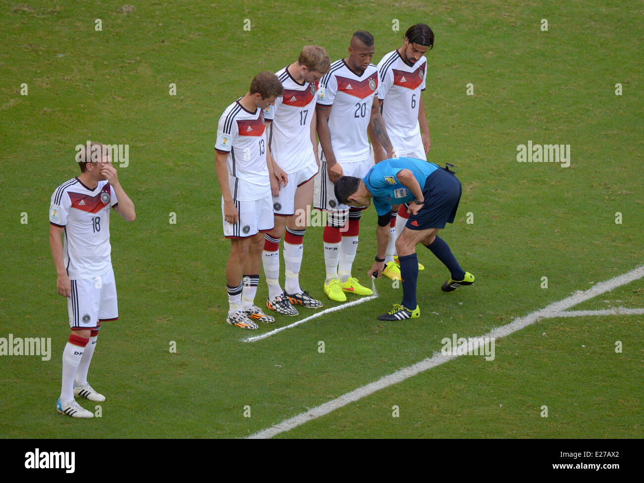 Salvador da Bahia, Brazil. 16th June, 2014. Salvador da Bahia, Brazil.  16th June, 2014. Serbian referee Milorad Mazic sprays a marker line in front of Germany's Sami Khedira, Jerome Boateng, Per Mertesacker, Thomas Mueller and Toni Kroos during the FIFA World Cup 2014 group G preliminary round match between Germany and Portugal at the Arena Fonte Nova Stadium in Salvador da Bahia, Brazil, 16 June 2014. Photo: Thomas Eisenhuth/dpa Credit:  dpa picture alliance/Alamy Live News Stock Photo