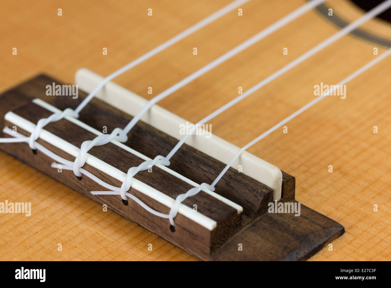 Closeup of ukulele hawaiian guitar body. Focus on bridge Stock Photo - Alamy