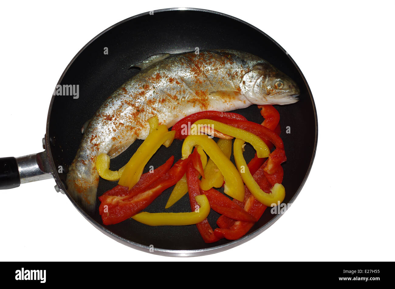 Fish Frying Outdoors In A Cast Iron Pan On Grill Stock Photo