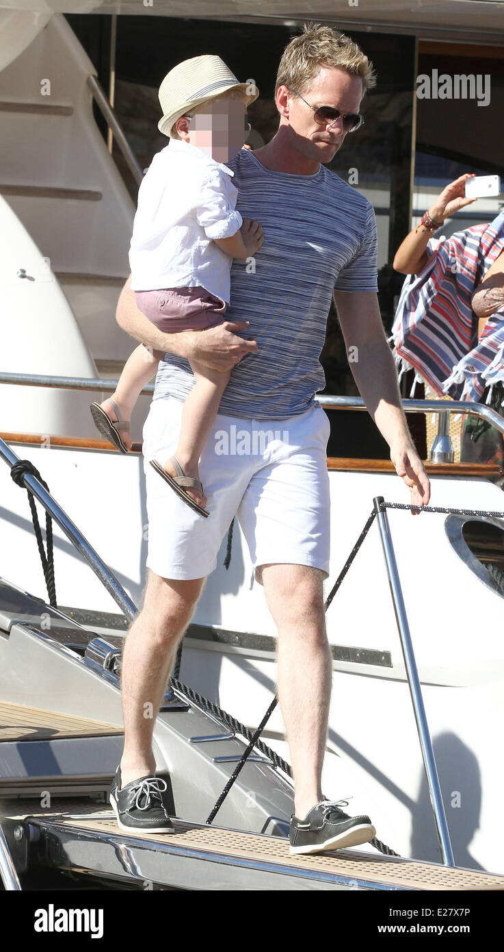 David Furnish, Neil Patrick Harris and David Burtka arrive with their  children at the Club 55 for lunch. After lunch they take a stroll around  Saint-Tropez town. Featuring: Neil Patrick Harris,Gideon Scott, image size:737x1390