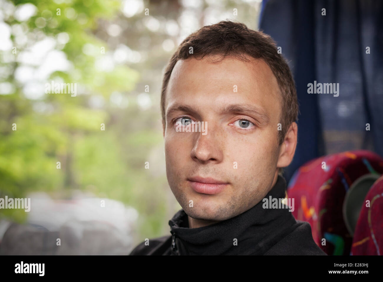 Passenger in the Bus, Portrait of Young Caucasian man Stock Photo