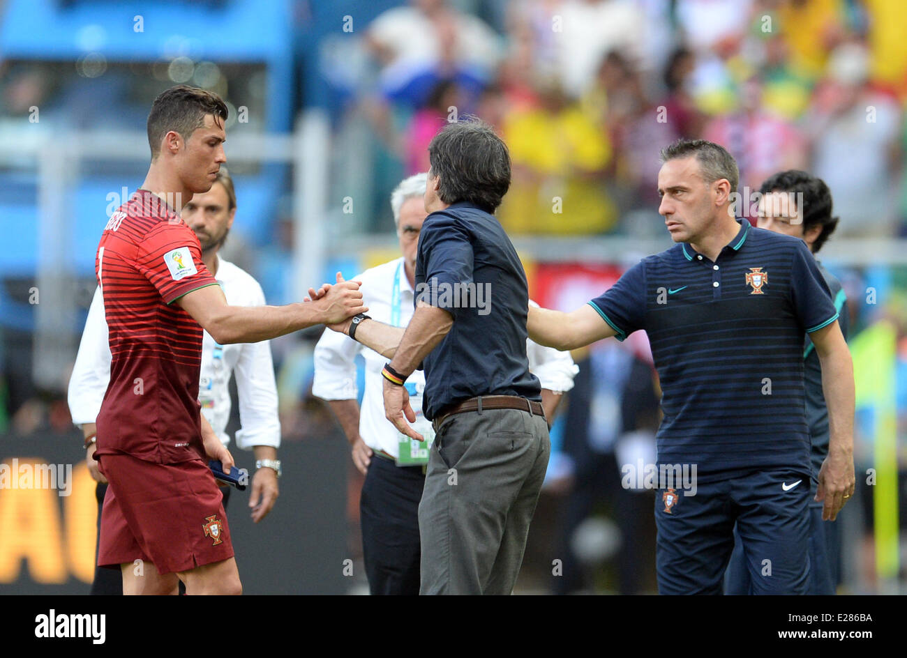 Salvador da Bahia, Brazil. 16th June, 2014. Portugal's Cristiano Ronaldo (L-R) shakes hands with head coach Joachim Loew of Germany and head coach Paulo Bento of Portugal during the FIFA World Cup 2014 group G preliminary round match between Germany and Portugal at the Arena Fonte Nova Stadium in Salvador da Bahia, Brazil, 16 June 2014. Credit:  dpa picture alliance/Alamy Live News Stock Photo