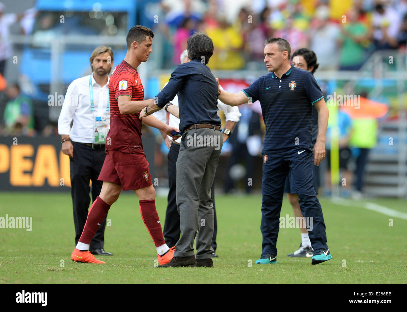 Salvador da Bahia, Brazil. 16th June, 2014. Portugal's Cristiano Ronaldo (L-R) shakes hands with head coach Joachim Loew of Germany and head coach Paulo Bento of Portugal during the FIFA World Cup 2014 group G preliminary round match between Germany and Portugal at the Arena Fonte Nova Stadium in Salvador da Bahia, Brazil, 16 June 2014. Credit:  dpa picture alliance/Alamy Live News Stock Photo