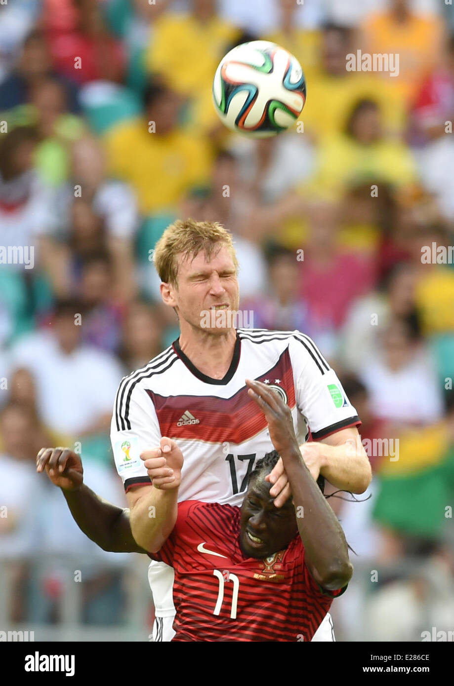 Salvador da Bahia, Brazil. 16th June, 2014. Per Mertesacker of Germany (top) vies for the ball with Eder of Portugal during the FIFA World Cup 2014 group G preliminary round match between Germany and Portugal at the Arena Fonte Nova Stadium in Salvador da Bahia, Brazil, 16 June 2014. Credit:  dpa picture alliance/Alamy Live News Stock Photo