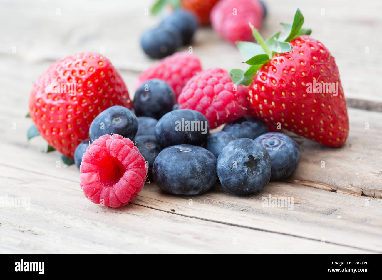 natural shot on old wooden background of summer berries Stock Photo