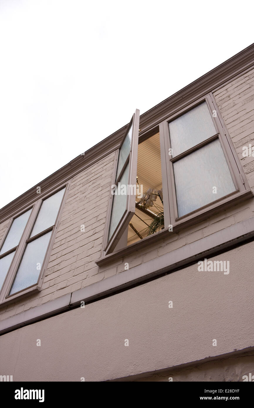 A building with an open window Stock Photo