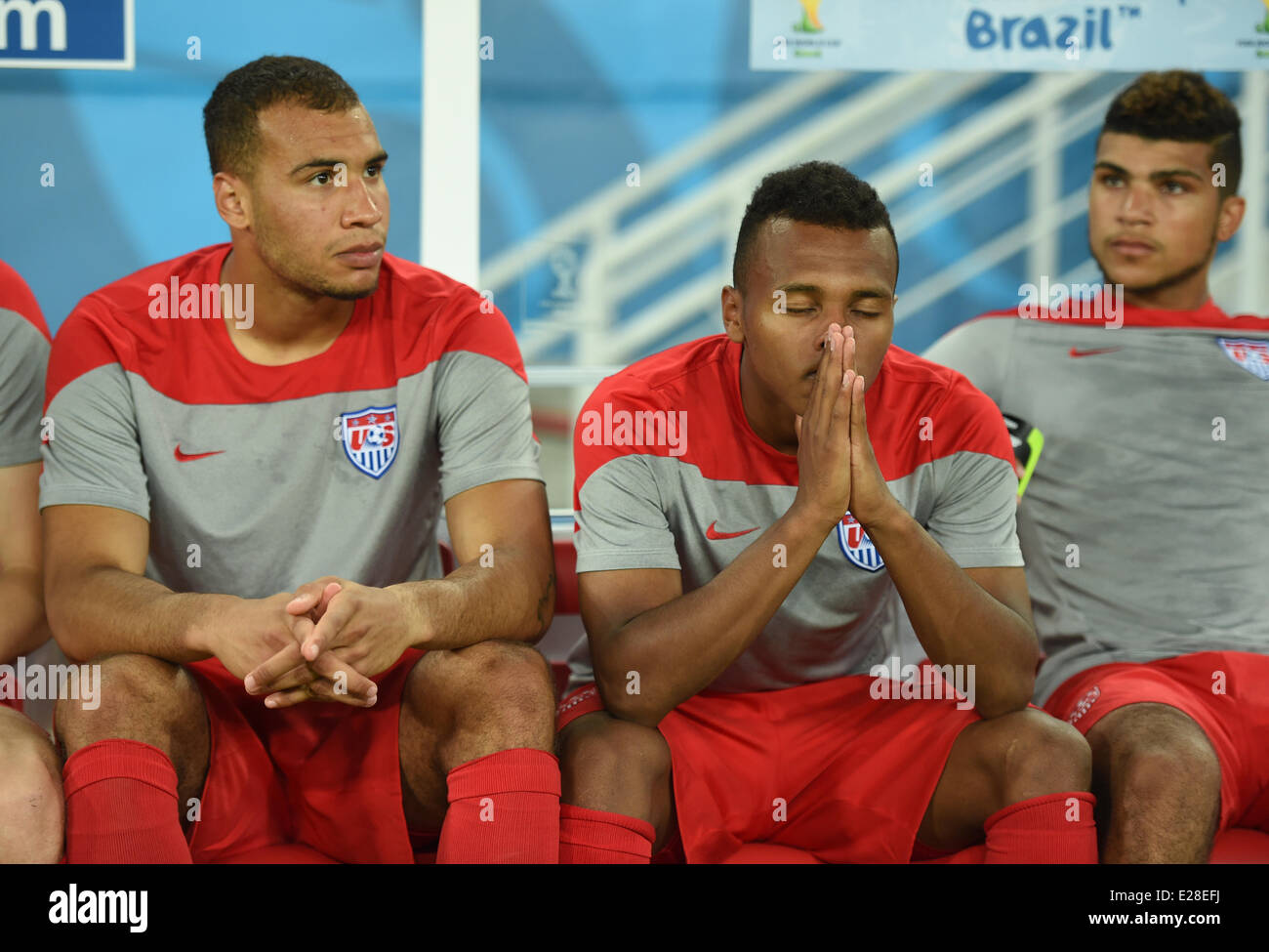 Natal, Brazil. 16th June, 2014. (L-R) John Brooks, Julian Green and DeAndre Yedlin, of USA sit on the bench before the FIFA World Cup 2014 group G preliminary round match between Ghana and the USA at the Estadio Arena das Dunas Stadium in Natal, Brazil, 16 June 2014. Credit:  dpa picture alliance/Alamy Live News Stock Photo