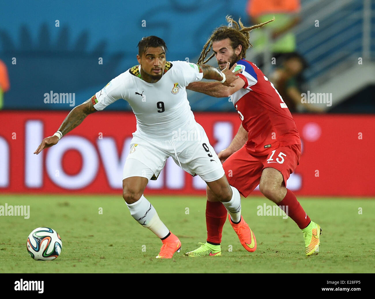 Natal, Brazil. 16th June, 2014. Kevin Prince Boateng (L) of Ghana in action against Kyle Beckerman of USA during the FIFA World Cup 2014 group G preliminary round match between Ghana and the USA at the Estadio Arena das Dunas Stadium in Natal, Brazil, 16 June 2014. Credit:  dpa picture alliance/Alamy Live News Stock Photo