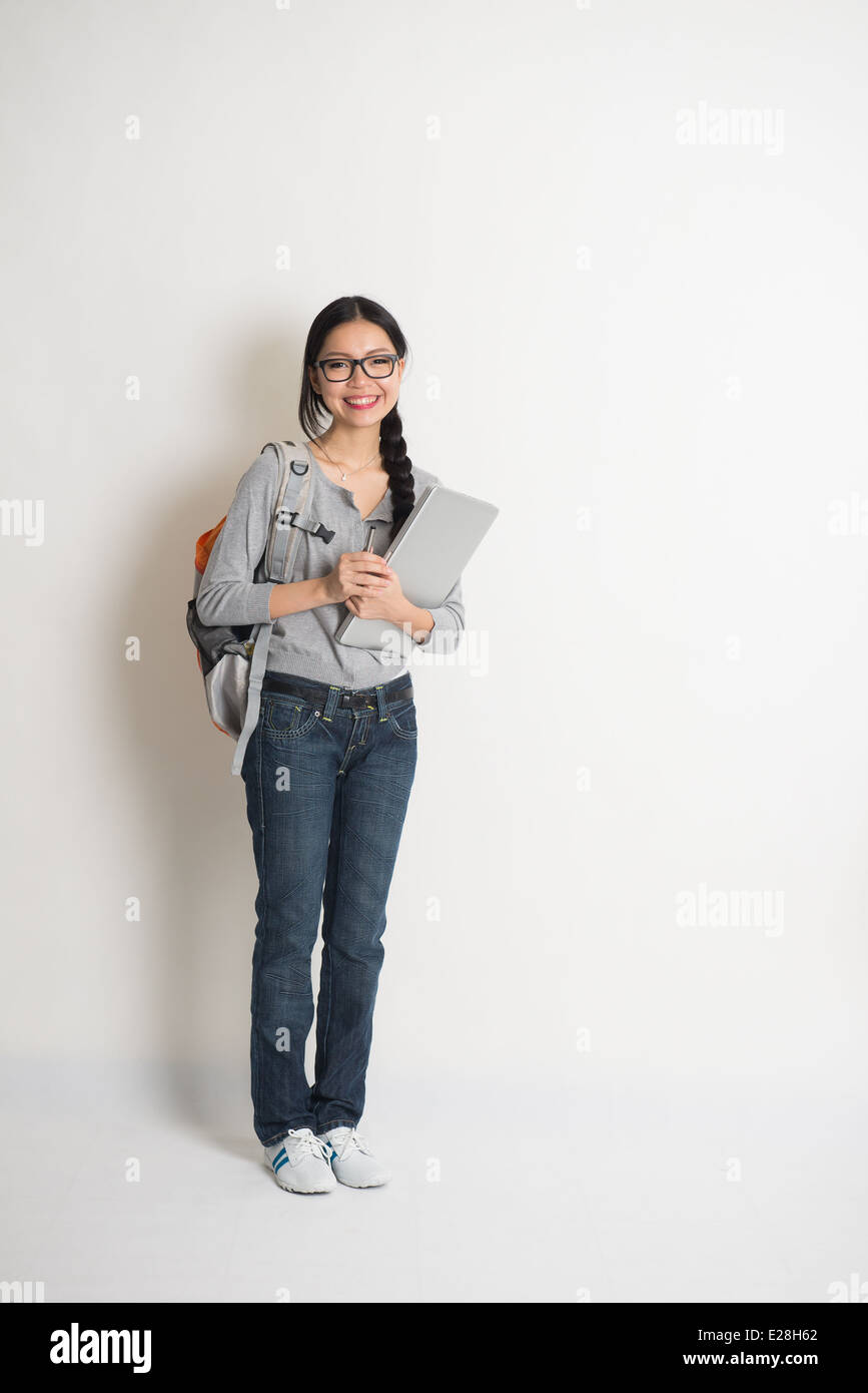 asian female college student with books and laptop Stock Photo - Alamy