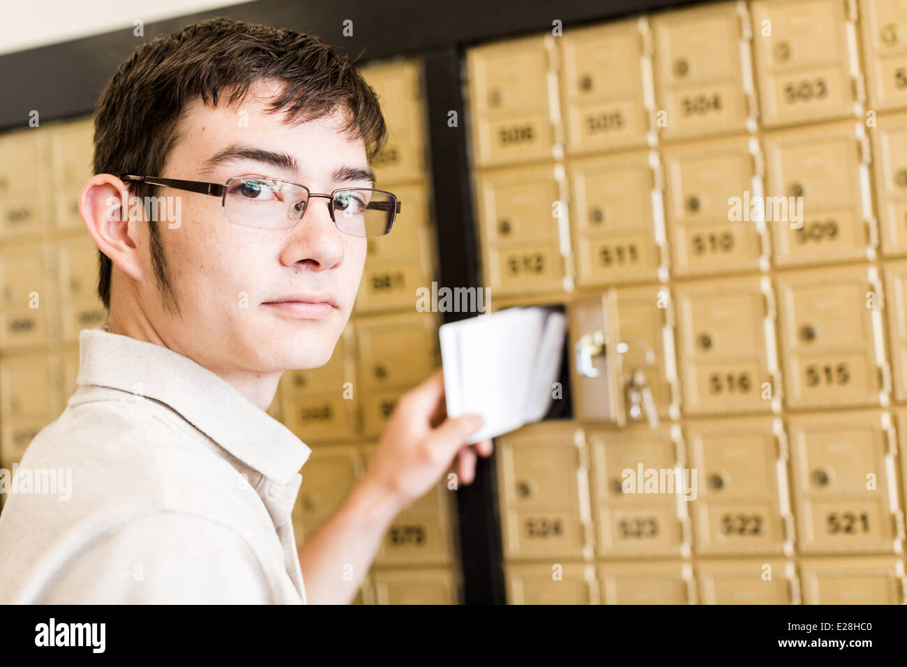 College student checking mail at mailboxed Stock Photo - Alamy