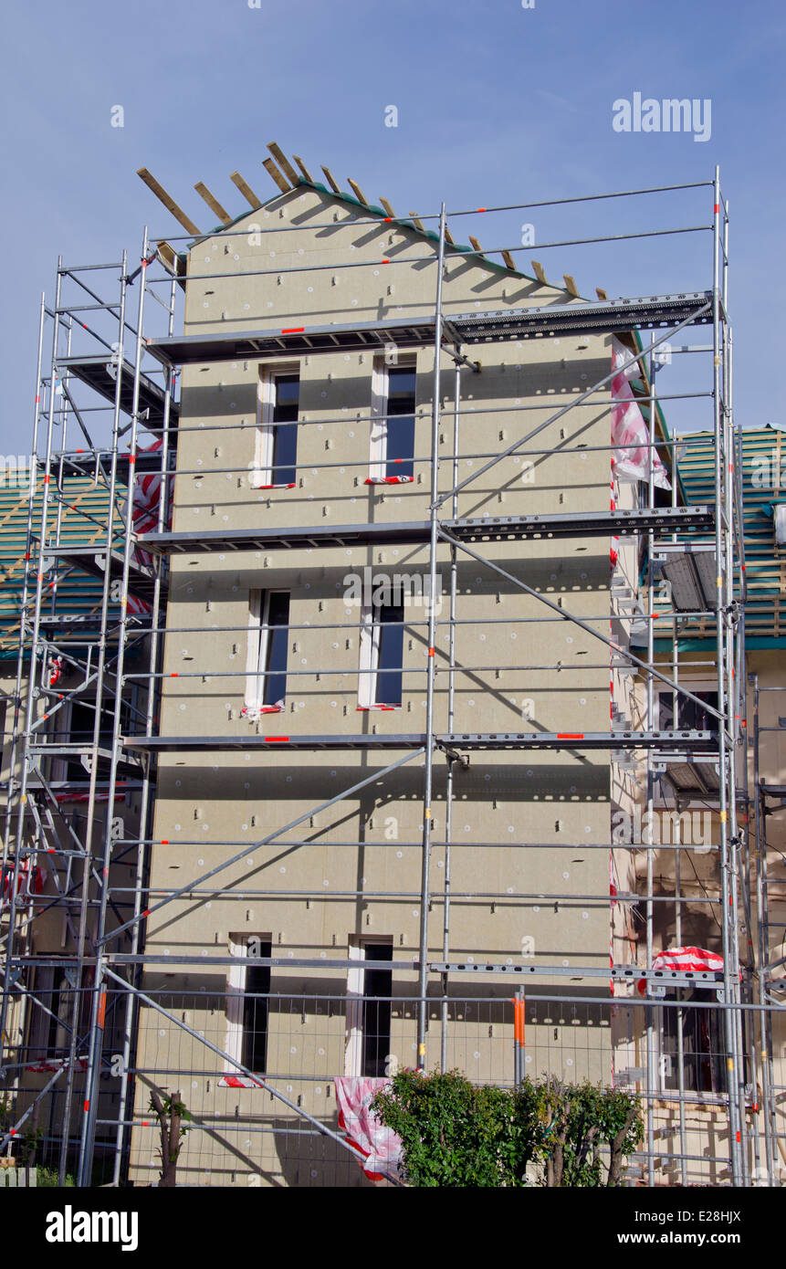 old house thermal insulation with mineral rockwool and scaffolding