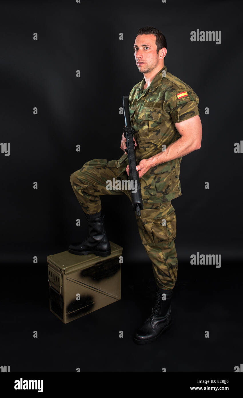 Spanish military with SMG on black background Stock Photo