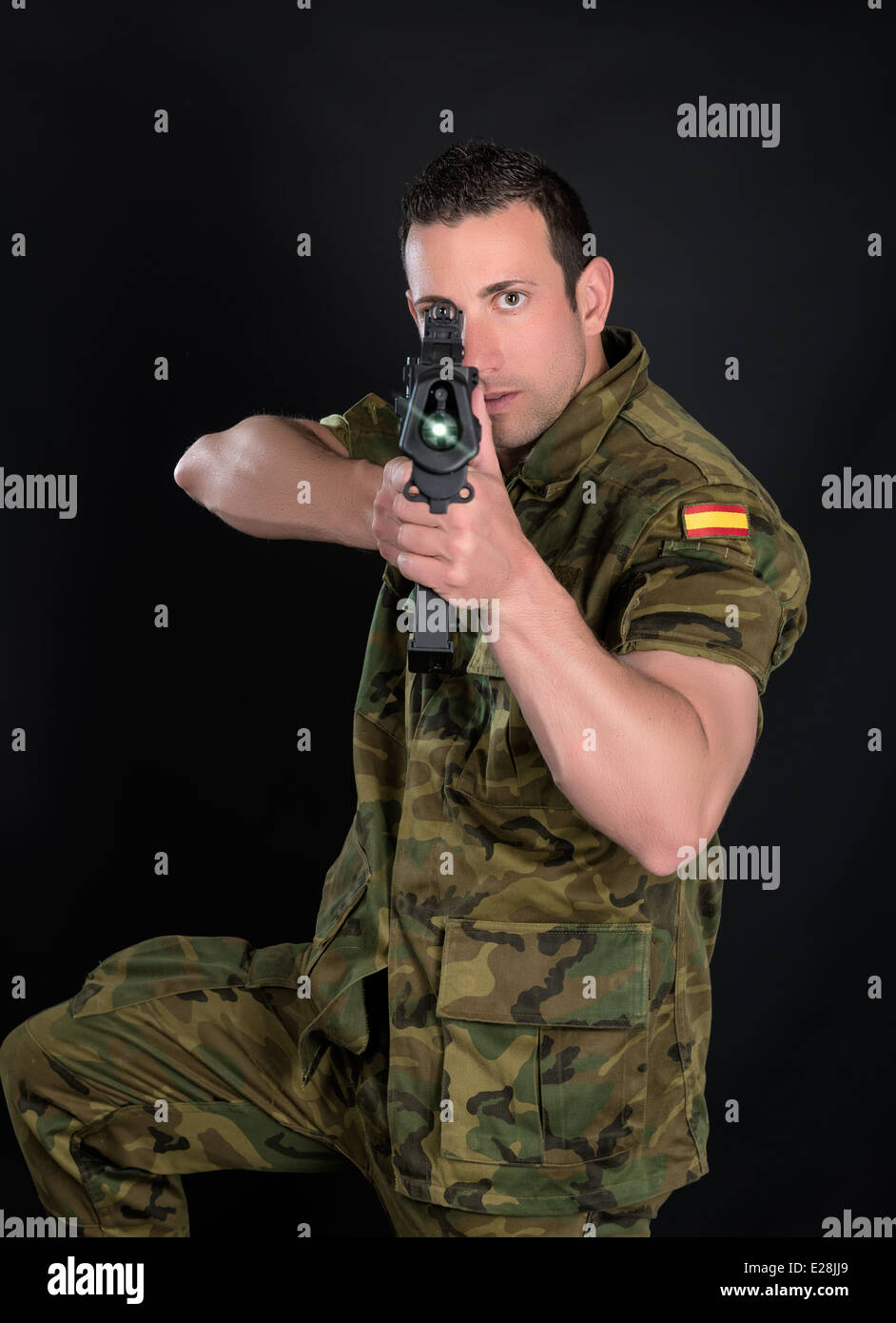 Spanish military with SMG on black background Stock Photo