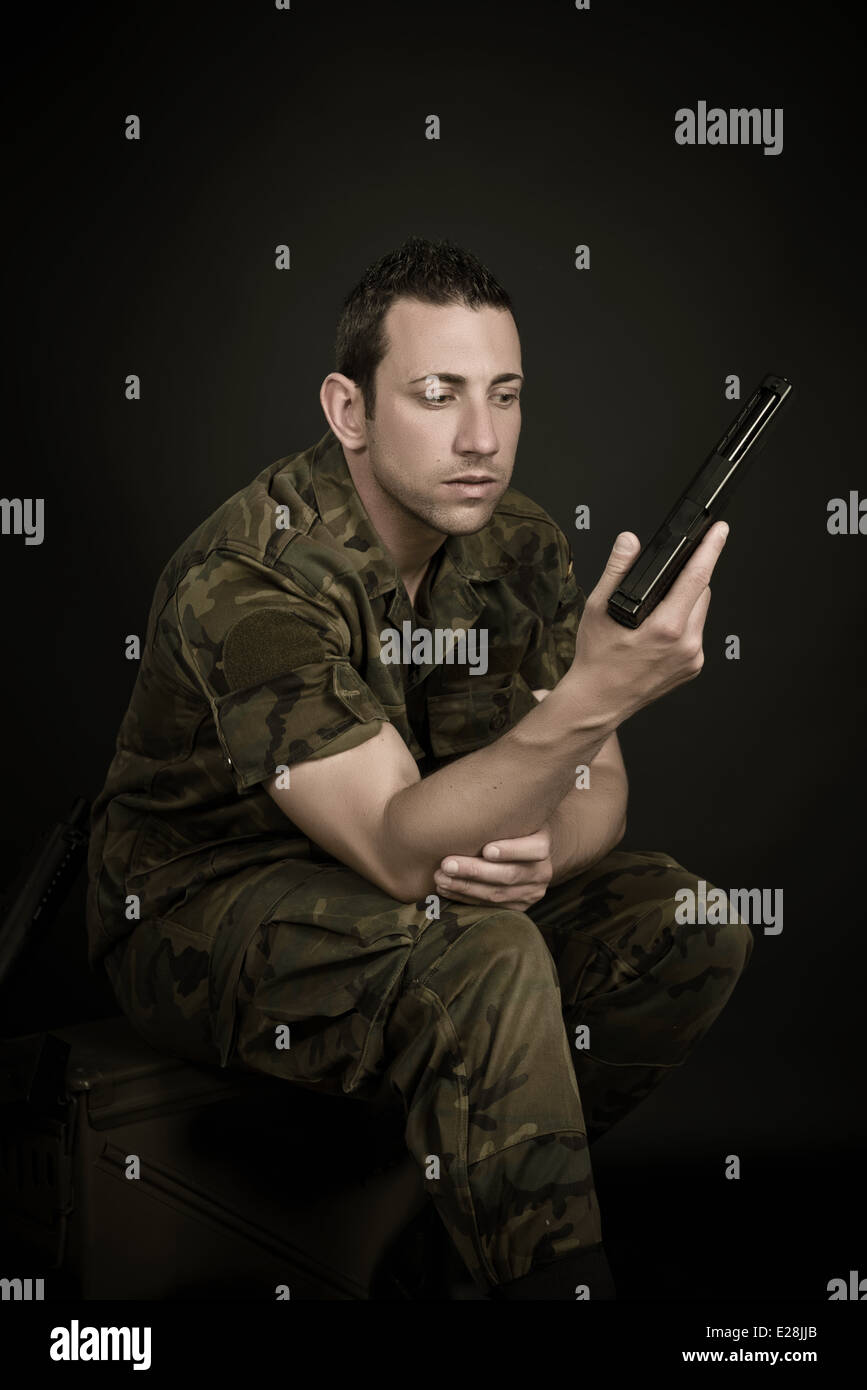 Spanish military with gun on black background Stock Photo