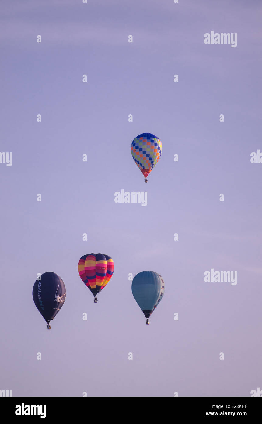 view of hot air balloons flying over grape fields near BRISSAC-QUINCE town Stock Photo