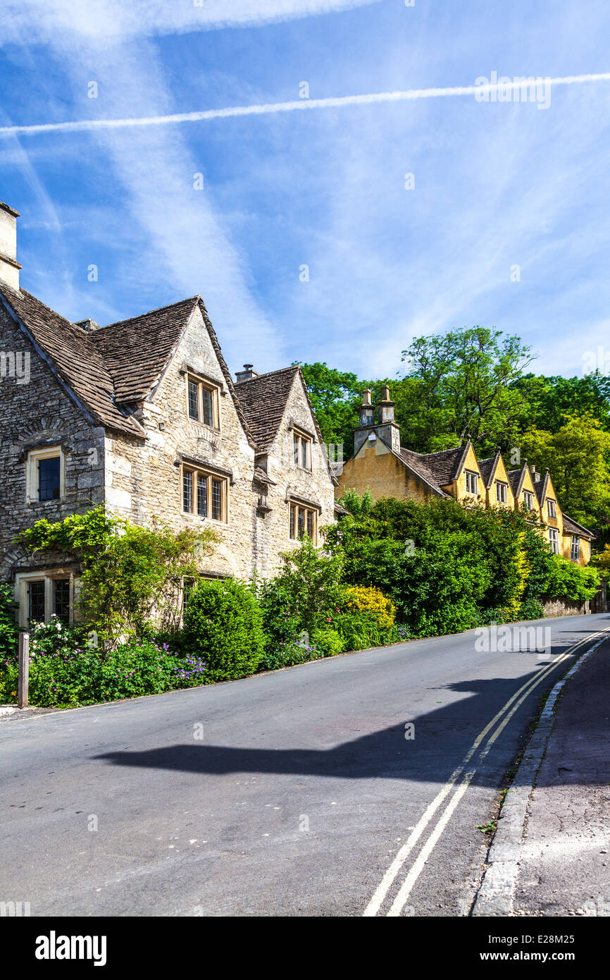 A lane of pretty terraced stone cottages in the Cotswold village of Castle Combe in Wiltshire. Stock Photo