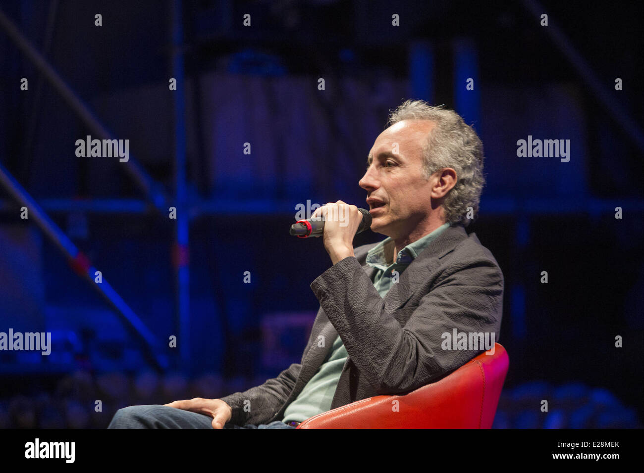 Turin, Italy. 16th June, 2014. Marco Travaglio vice director of ''Il Fatto quotidiano''presents his book ''E' stato Mafia.'' An intense monologue, in which he tells the taboo-negotiation between the state and the mafia, carried out by men of the institutions and leaders of Cosa Nostra during the bloody years 1992 and 1993. Credit:  Mauro Ujetto/NurPhoto/ZUMAPRESS.com/Alamy Live News Stock Photo