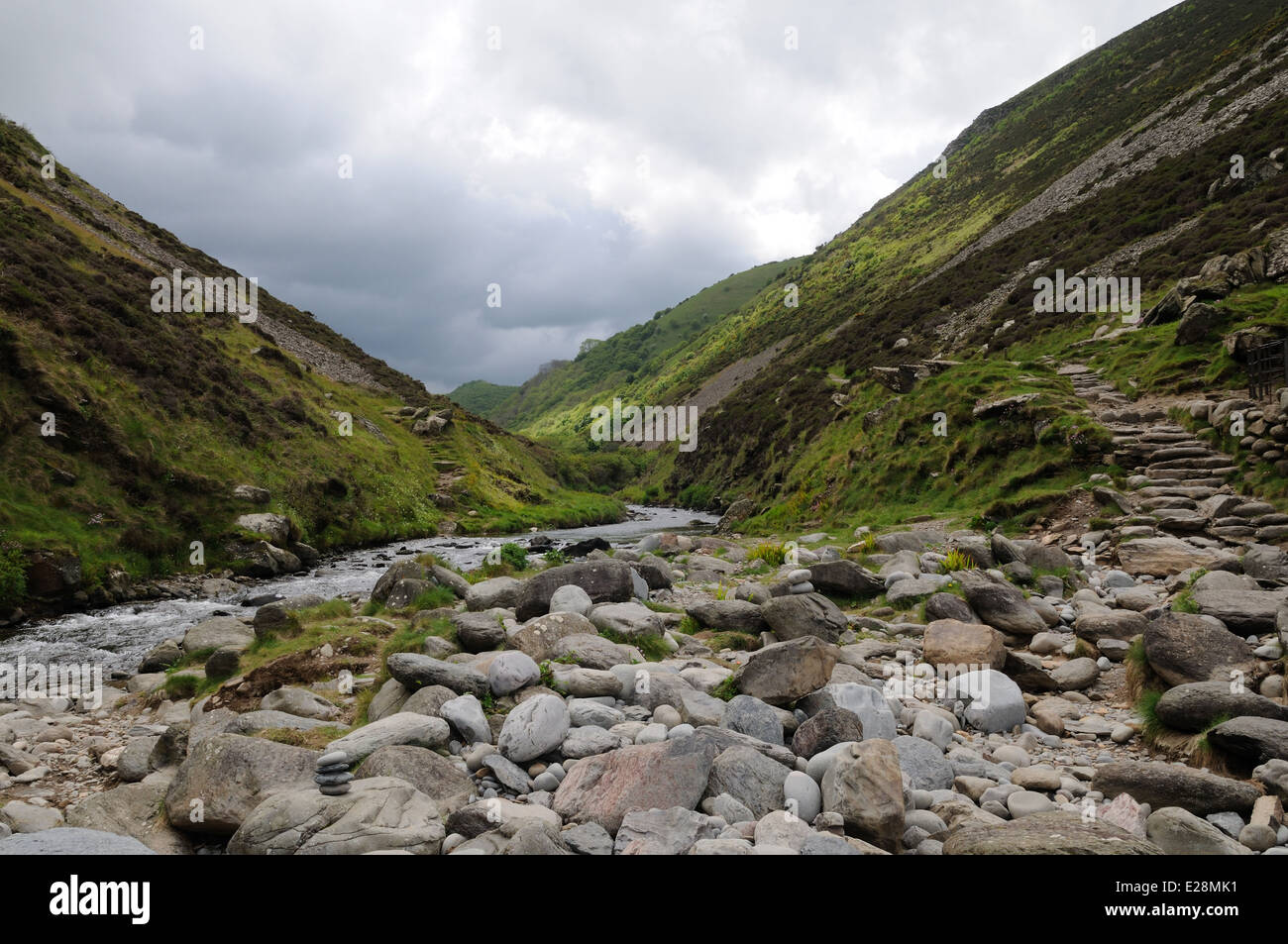 Heddon River flowing in to Heddons Mouth rocky beach Exmoor National Park Devon England UK GB Stock Photo