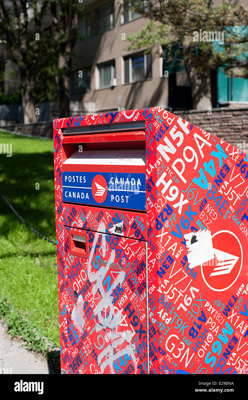 Eye catching Canada Post letter box designed to make graffiti harder to see. Stock Photo