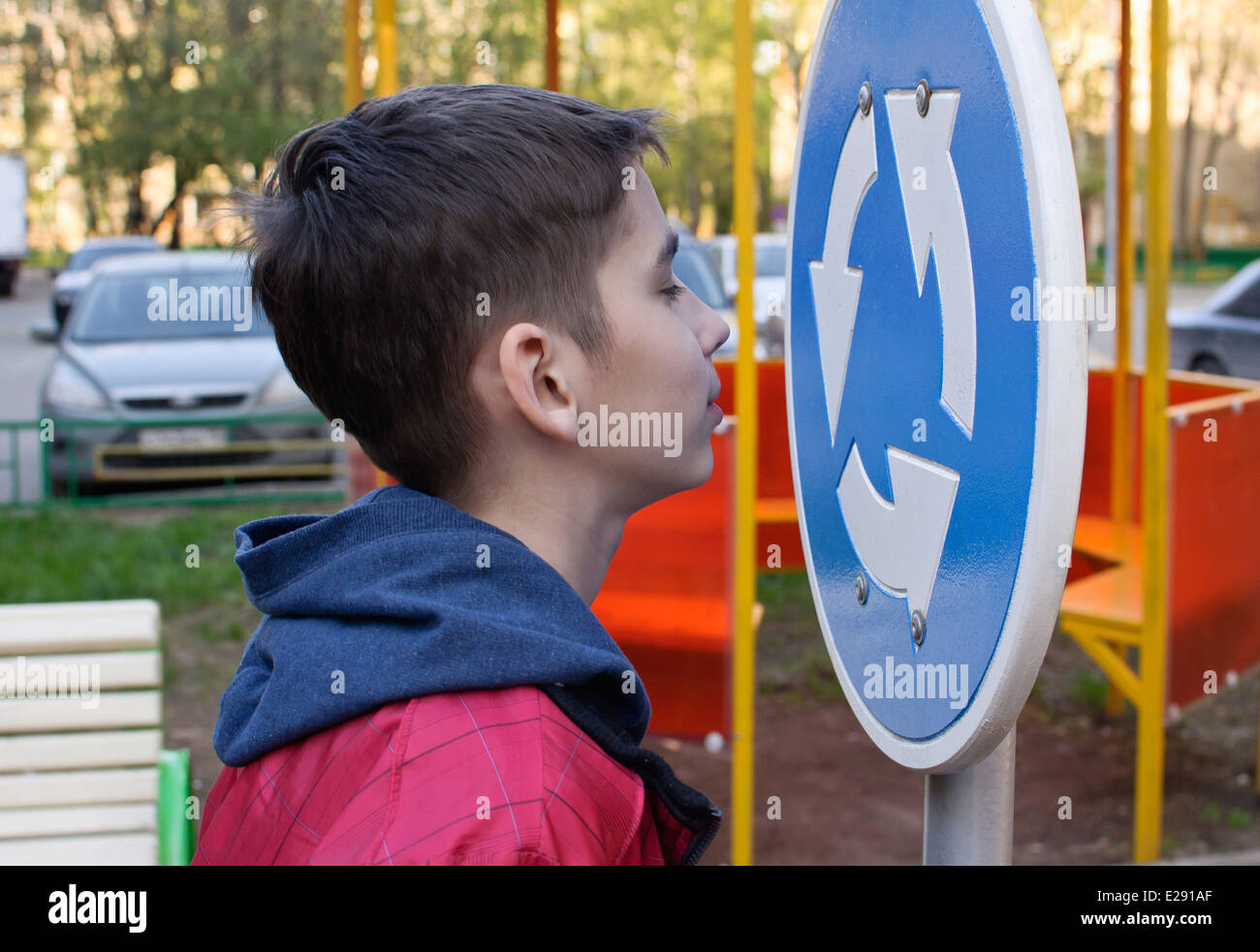 Teen and road sign Stock Photo - Alamy