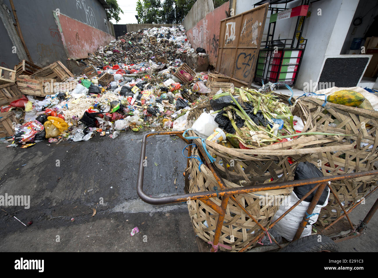 Large pile of rubbish and collection baskets in city, Manggarai District, Jakarta, Java, Indonesia, December Stock Photo