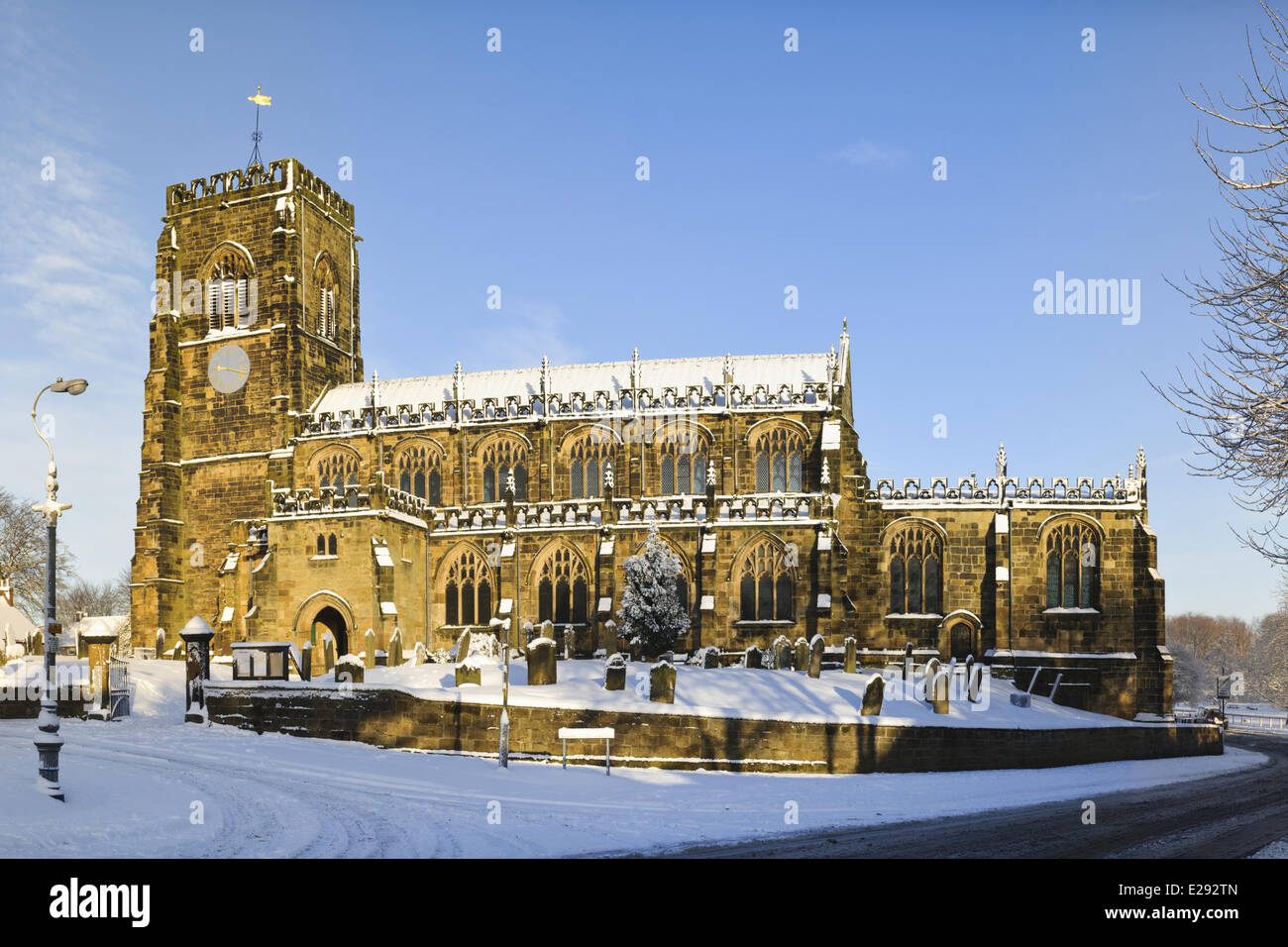 15th century church in snow on sunny day, St. Mary's Church, Thirsk, North Yorkshire, England, January Stock Photo