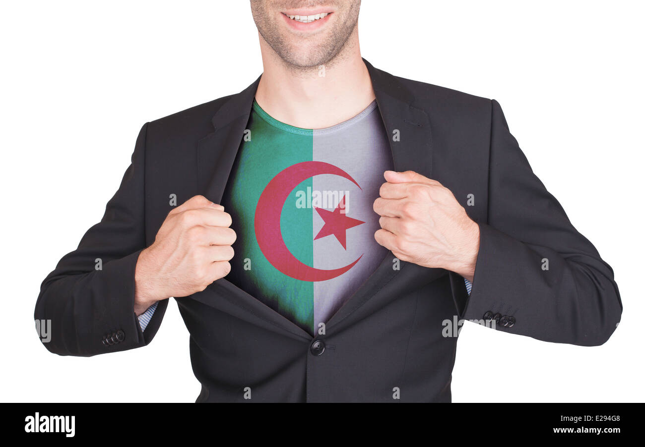 Businessman opening suit to reveal shirt with flag, Algeria Stock Photo