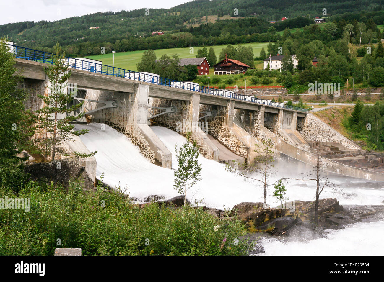 Huge amounts of water flowing in the river near the Hunderfossen hydroelectric power station in Norway. Stock Photo