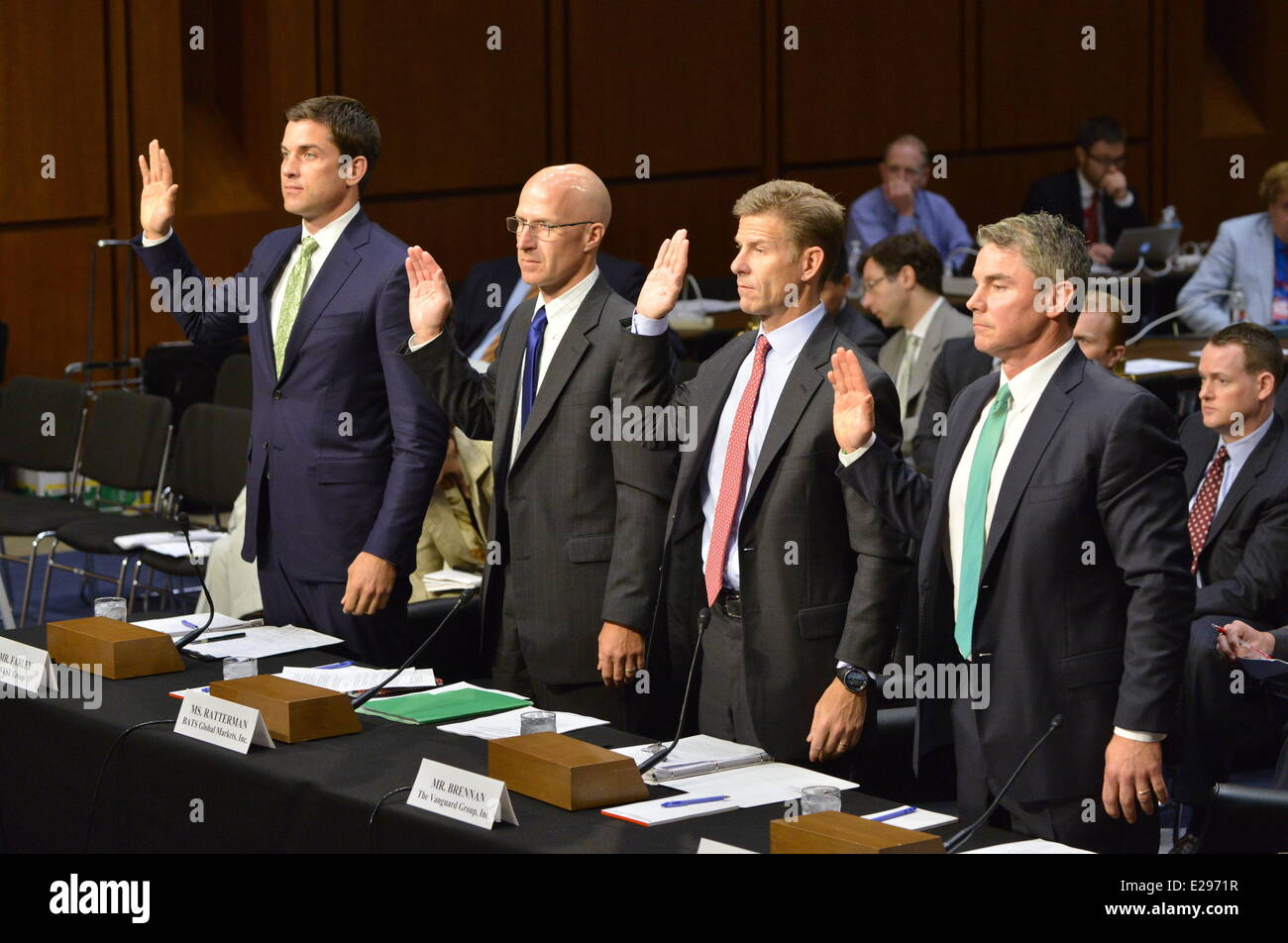 Washington, DC, USA. 17th June, 2013. A panel of financial executives is sworn in to testify on conflicts of interest and high-speed trading in U.S. stock markets before a subcommittee of the Senate Homeland Security and Government Affairs Committee. From left the panel includes: THOMAS W. FARLEY, president of NYSE Group; JOSEPH P. RATTERMAN, CEO of BATS Global Markets; JOSEPH P. BRENNAN, principal and head of Global Equity Index Group, The Vanguard Group, Inc., and STEVEN QUIRK, .at TD Ameritrade. © Jay Mallin/ZUMAPRESS.com/Alamy Live News Stock Photo