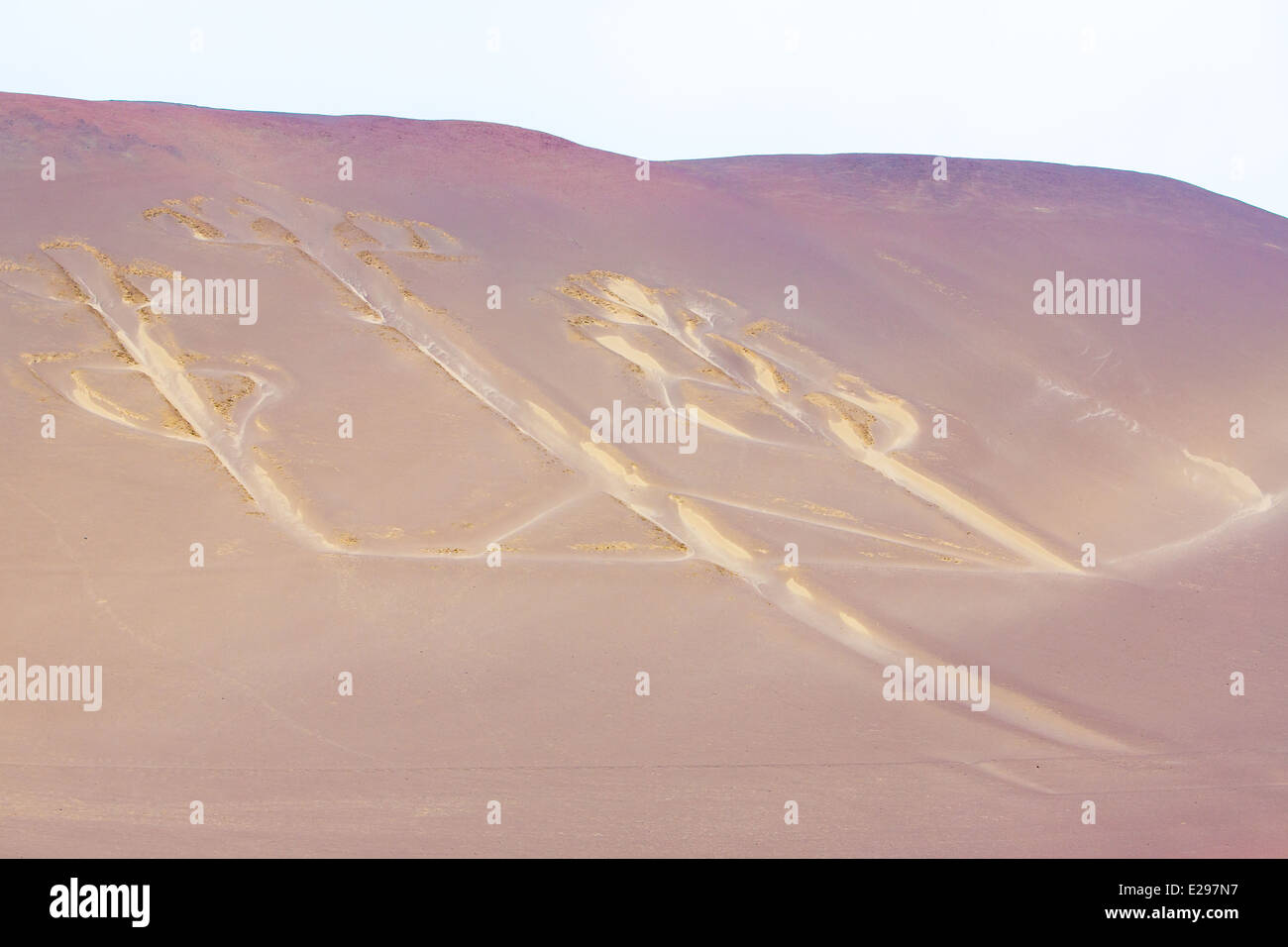Candelabra, Peru, ancient mysterious drawing in the desert sand, Paracas National Park Stock Photo