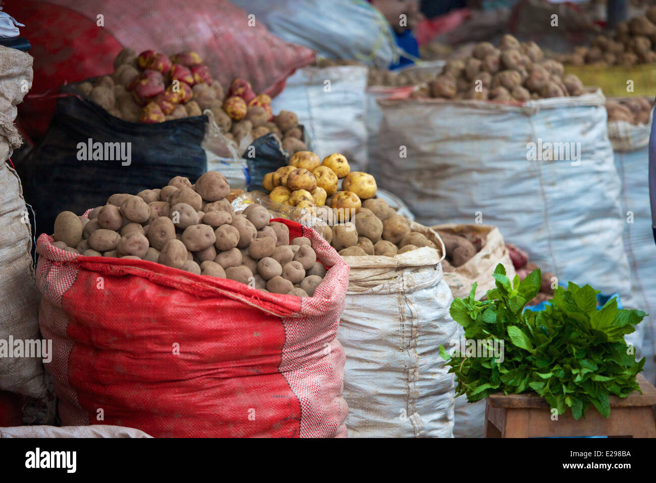 Produce and potatoes for sale at the vegetable market in Cusco, Peru, the ancient seat of the Inca Empire high in the Andes. Stock Photo
