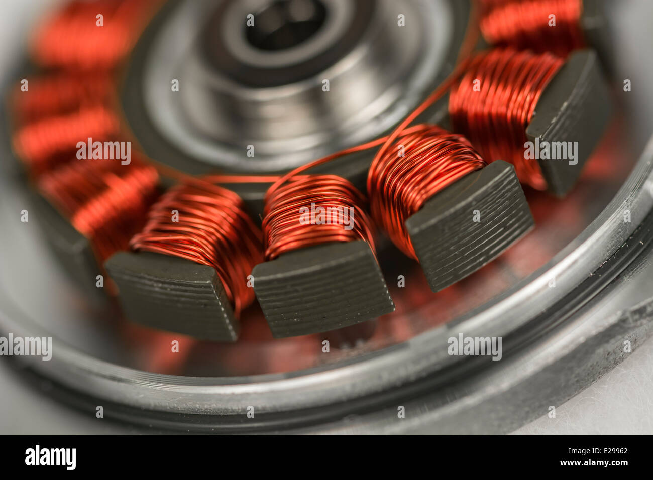 Macro photo of HDD / hard disk drive spindle motor with exposed copper stator coils. See 'description' for focus detail. Stock Photo