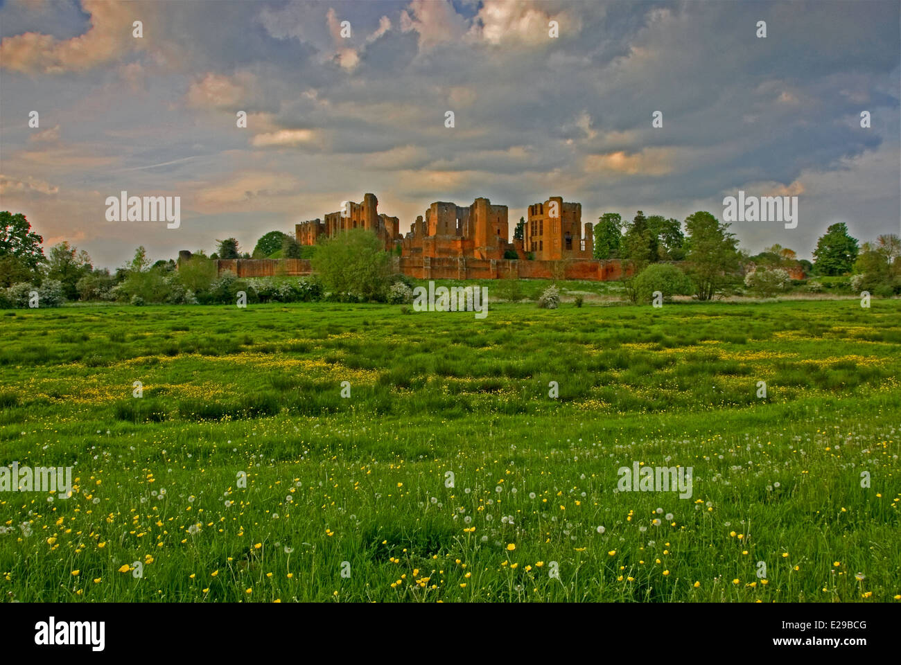 The ruins of Kenilworth Castle in Warwickshire can be seen from across farmland that once formed part of the moat. Stock Photo