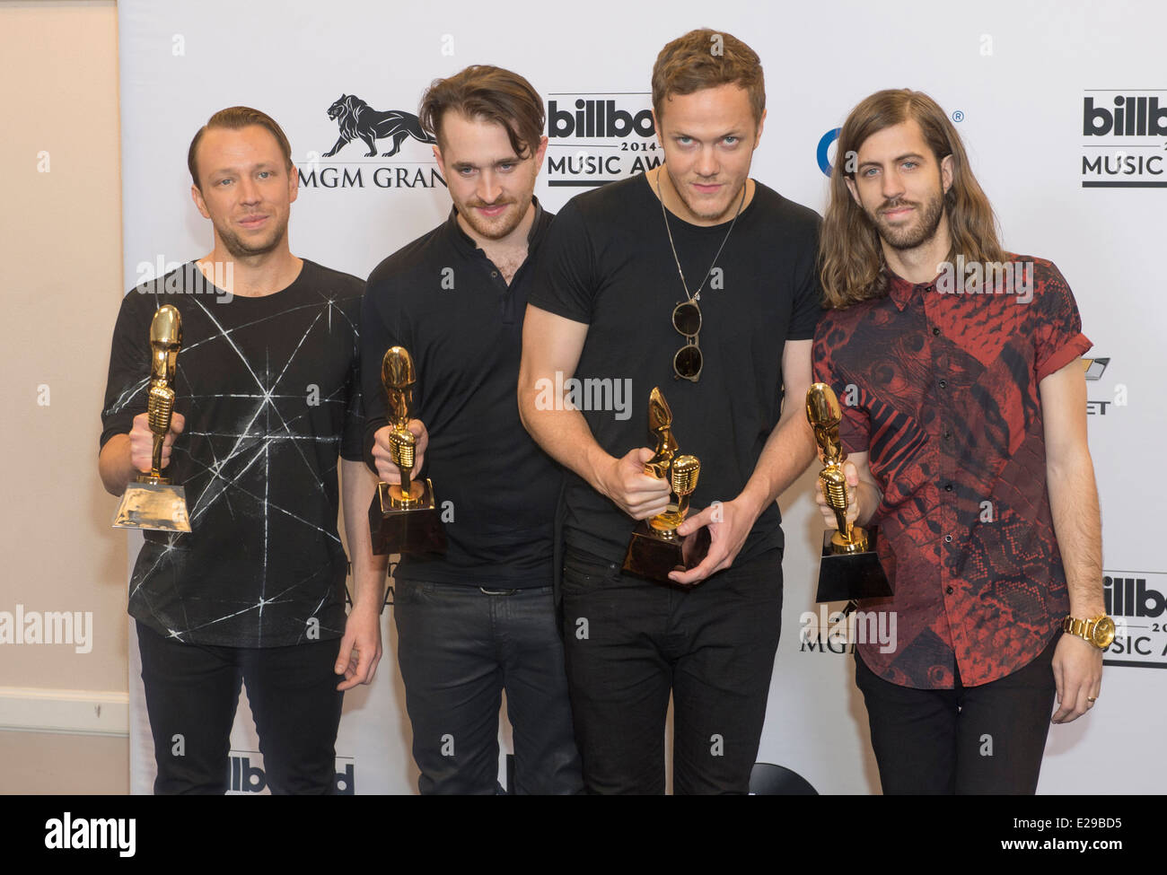 Members of the alternative rock band Imagine Dragons attend the 2014