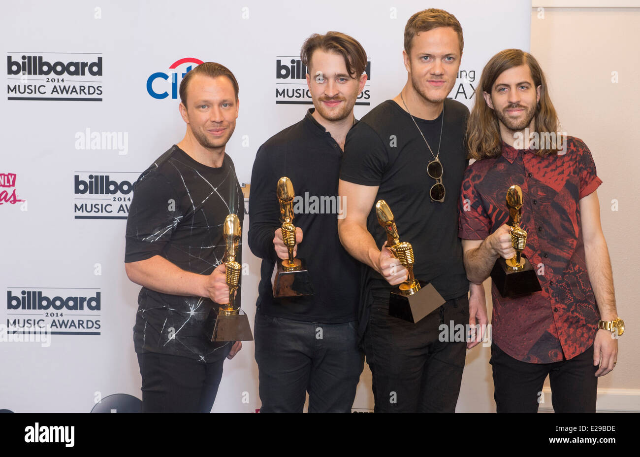 Members of the alternative rock band Imagine Dragons attend the 2014