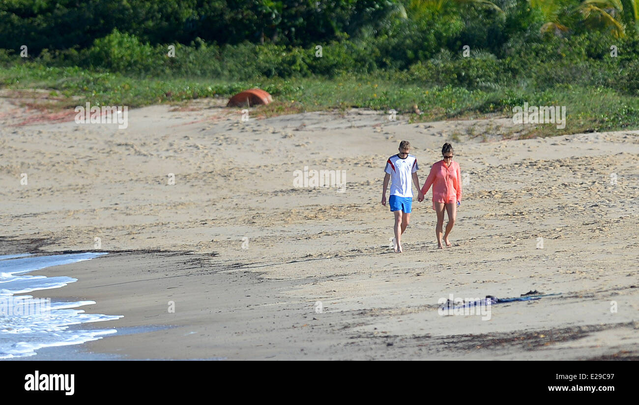 Santo Andre, Brazil. 17th June, 2014. Andre Schuerrle (l) on the beach with girlfriend Montana Yorke in Santo Andre, Brazil, 17 June 2014. The FIFA World Cup 2014 will take place in Brazil from 12 June to 13 July 2014. Photo: Thomas Eisenhuth/dpa/Alamy Live News Stock Photo