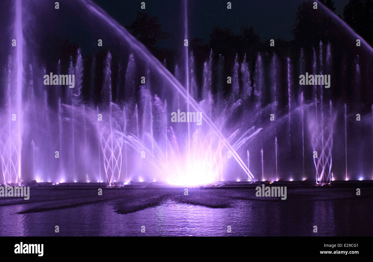 Color water fountain at night outdoor Stock Photo Alamy