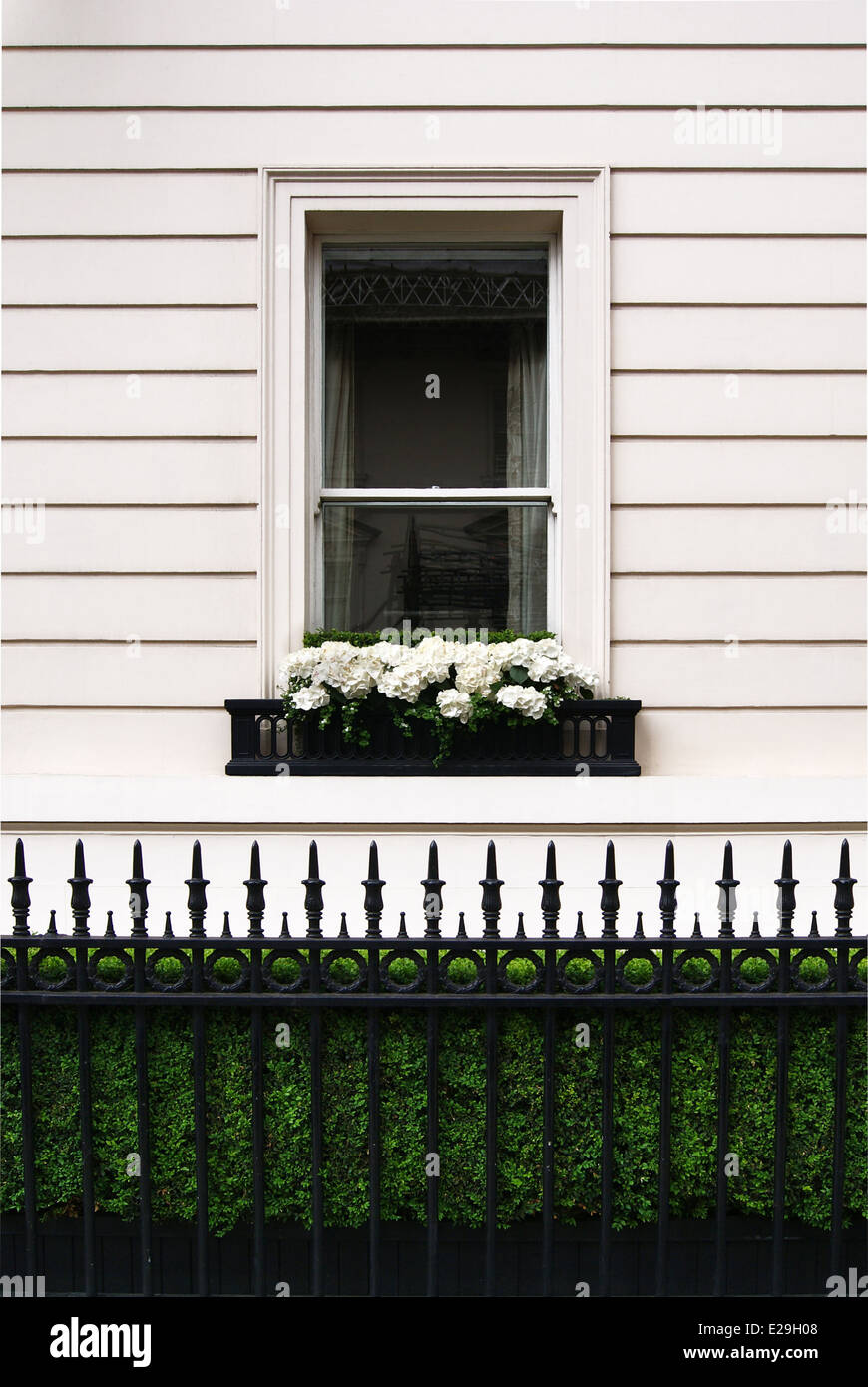 Sash Window  with wooden paneling, Ideal home capturing the fence and the wooded paneling. Stock Photo