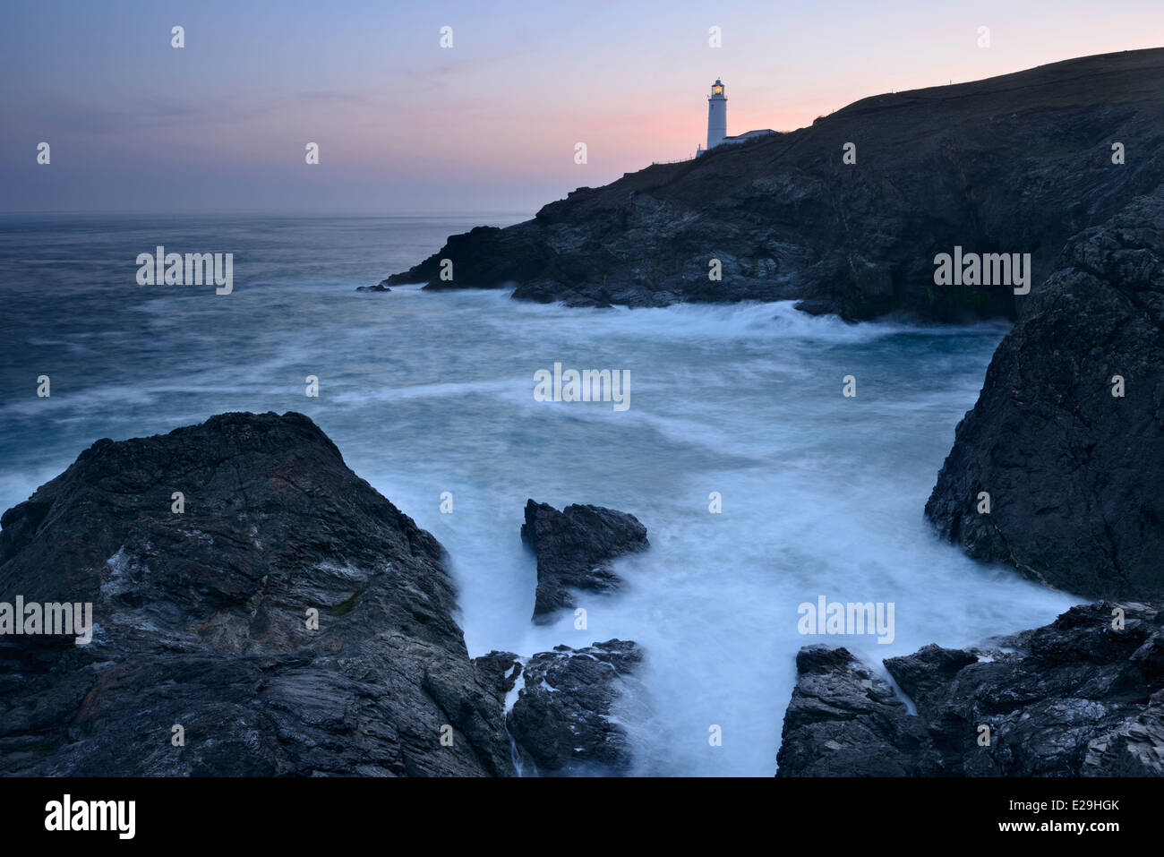 Dawn breaking in the sky above Trevose Head Lighthouse, Cornwall. Stock Photo