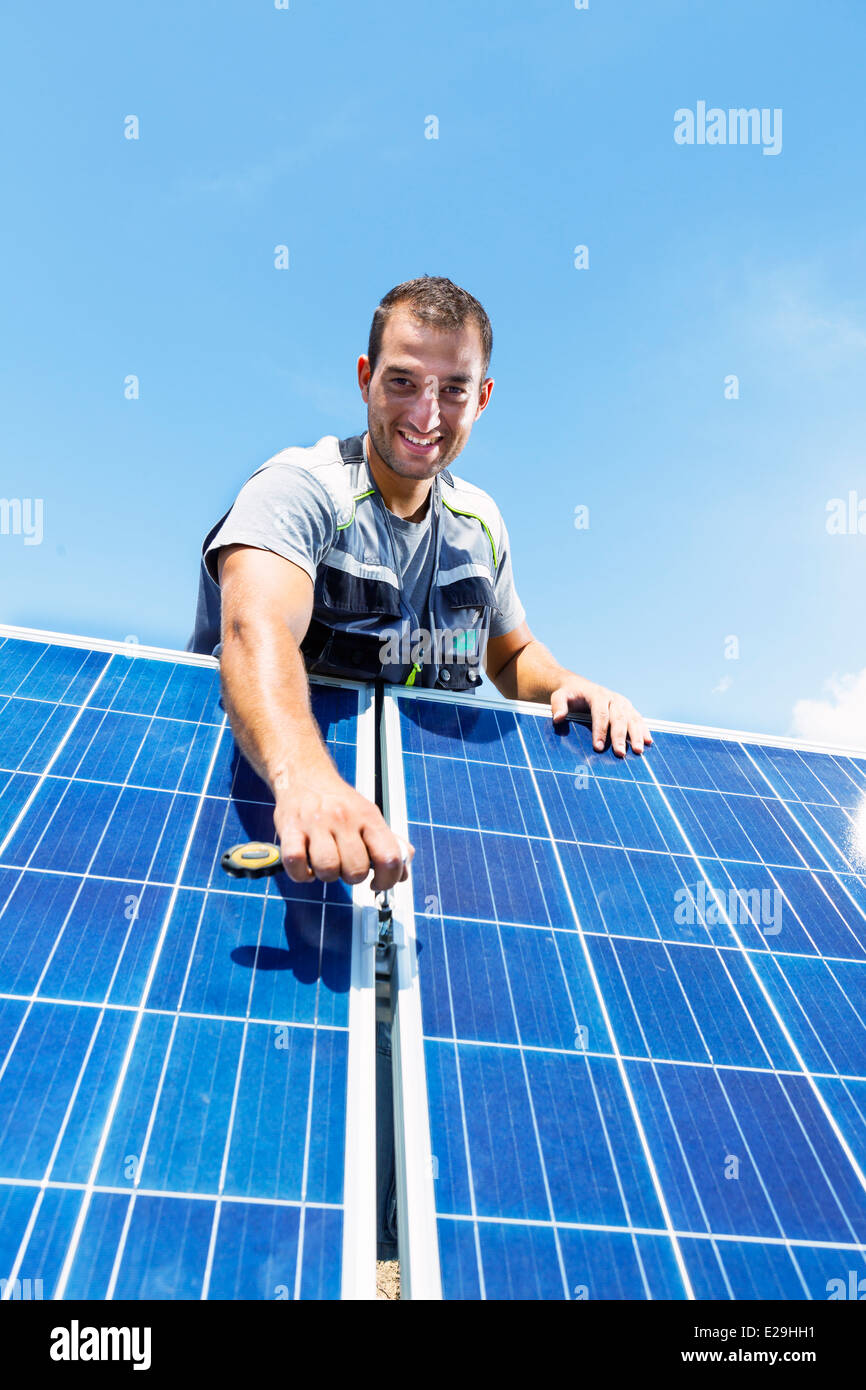 Professional installing electric solar panels Stock Photo Alamy