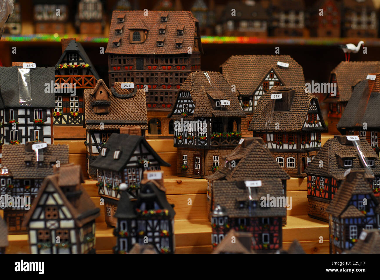 Miniatures of traditional Alsatian houses for sale in a Colmar Christmas market stall, Alsace, France Stock Photo