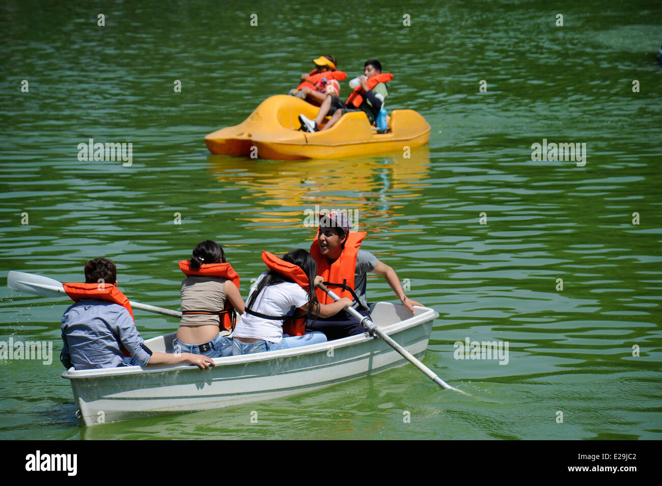 Teens and families boating on Lago Mayor de Chapultepec in Chapultepec Park, Mexico City, Mexico Stock Photo