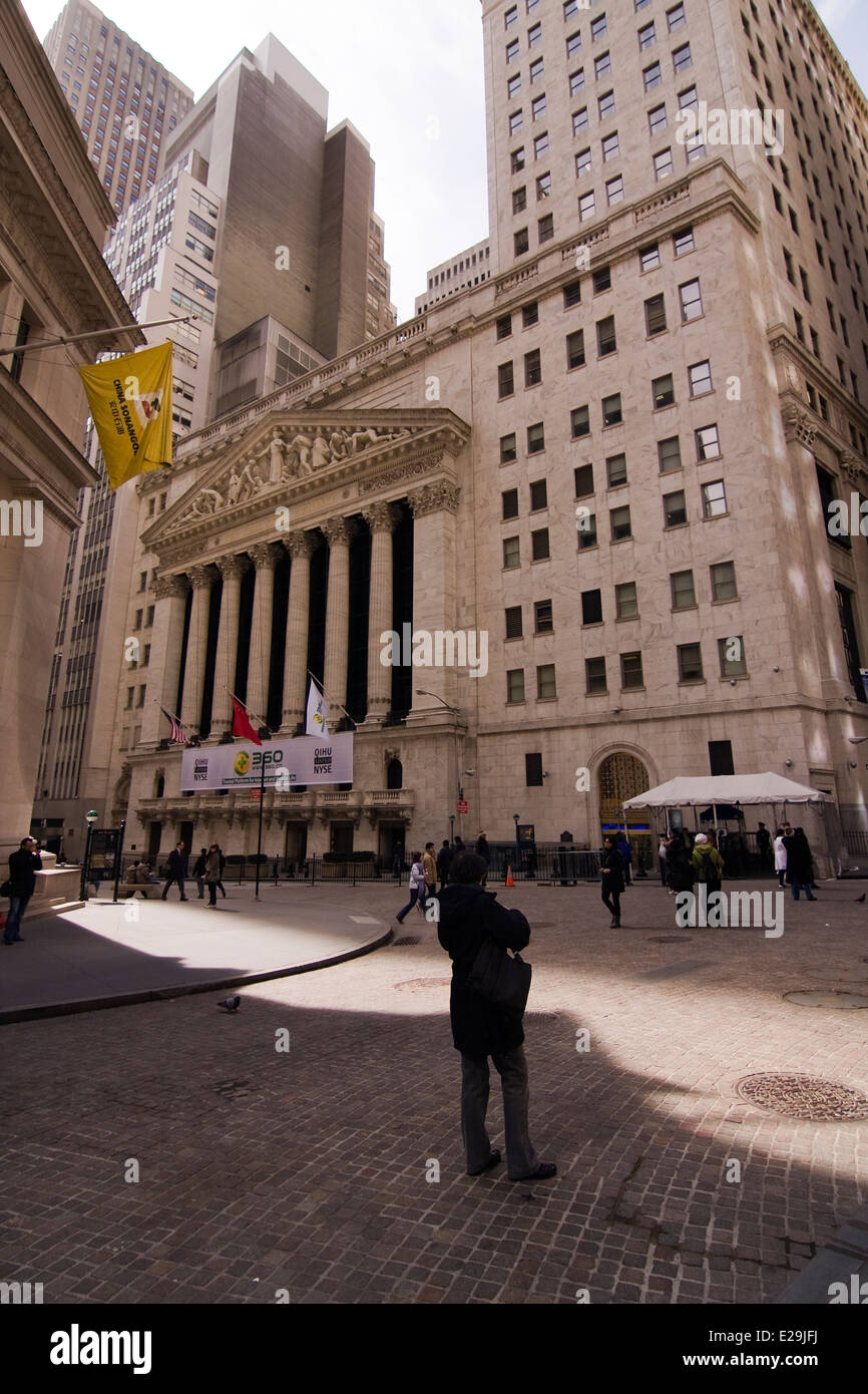The New York Stock Exchange on the corner of Broad and Wall St in the Lower Manhattan Neighborhood of New York City Stock Photo