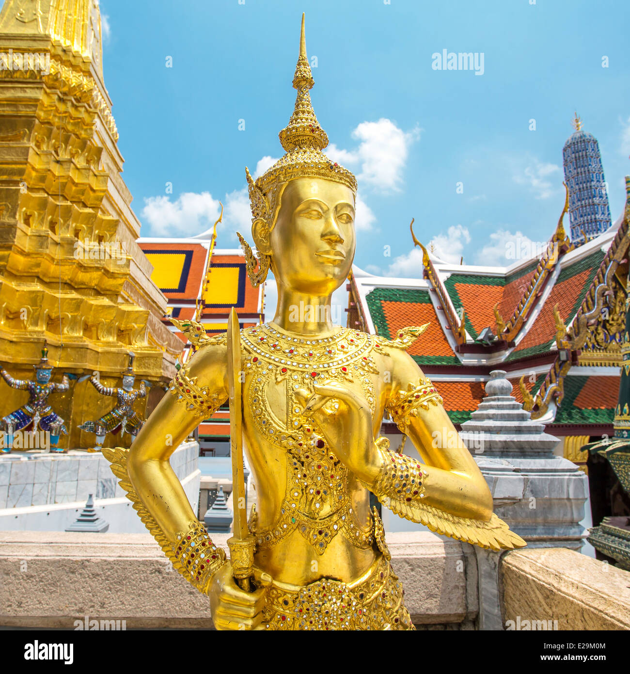 Golden Kinnara statue at Emerald Buddha Temple (Wat Phra Kaew) in Grand Palace, Bangkok Stock Photo
